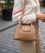 Elegant Quilted Mini Handbag with Signature Gold-Tone Clasp - Image 4