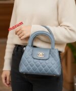 Elegant Quilted Mini Handbag with Signature Gold-Tone Clasp - Image 6